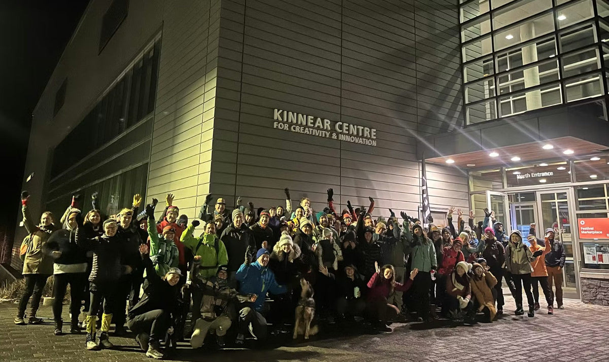 Oboz team gathers in front of building hosting the Banff Film Festival.