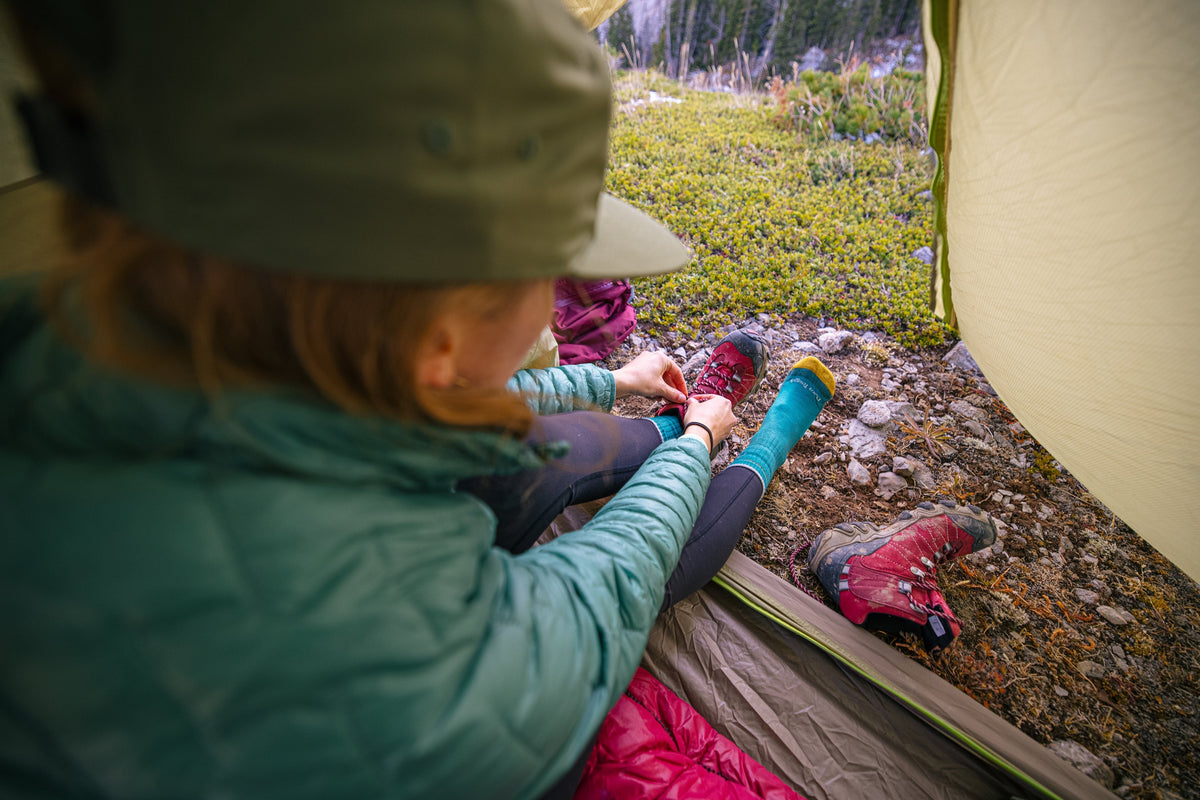 Keeping her feet warm and dry in the Rio Red Bridger Mid Waterproof while camping.