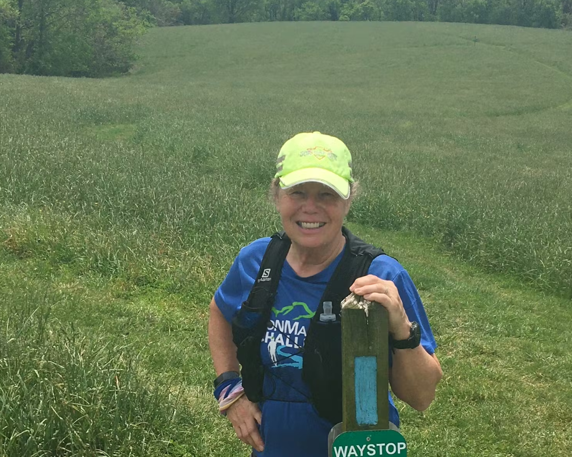 Roxanne Strine at a trail marker along the Mason Dixon Trail.