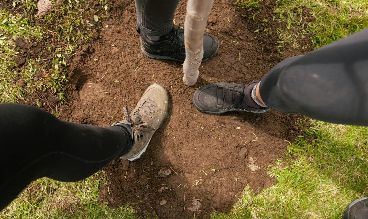 Oboz during a tree planting wearing Oboz hiking shoes. 