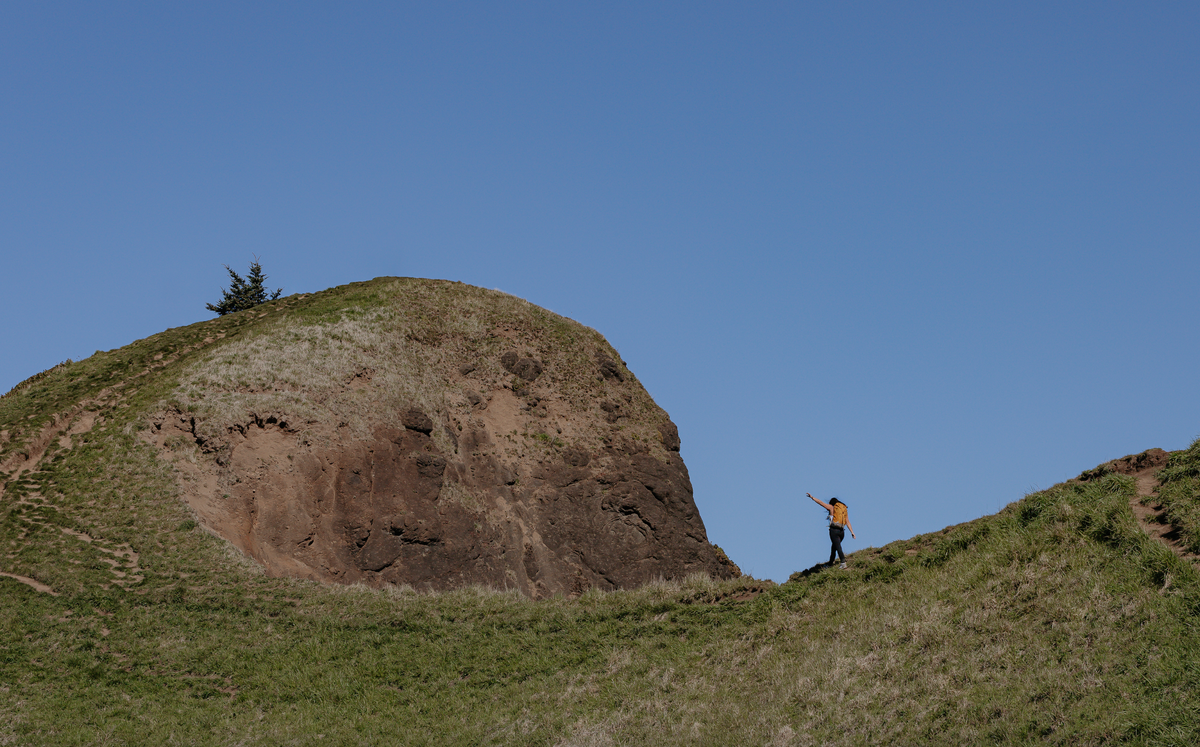 Lindsay Kagalis hiking the ridge of a mountain in the Women's Bozeman Mids shoes