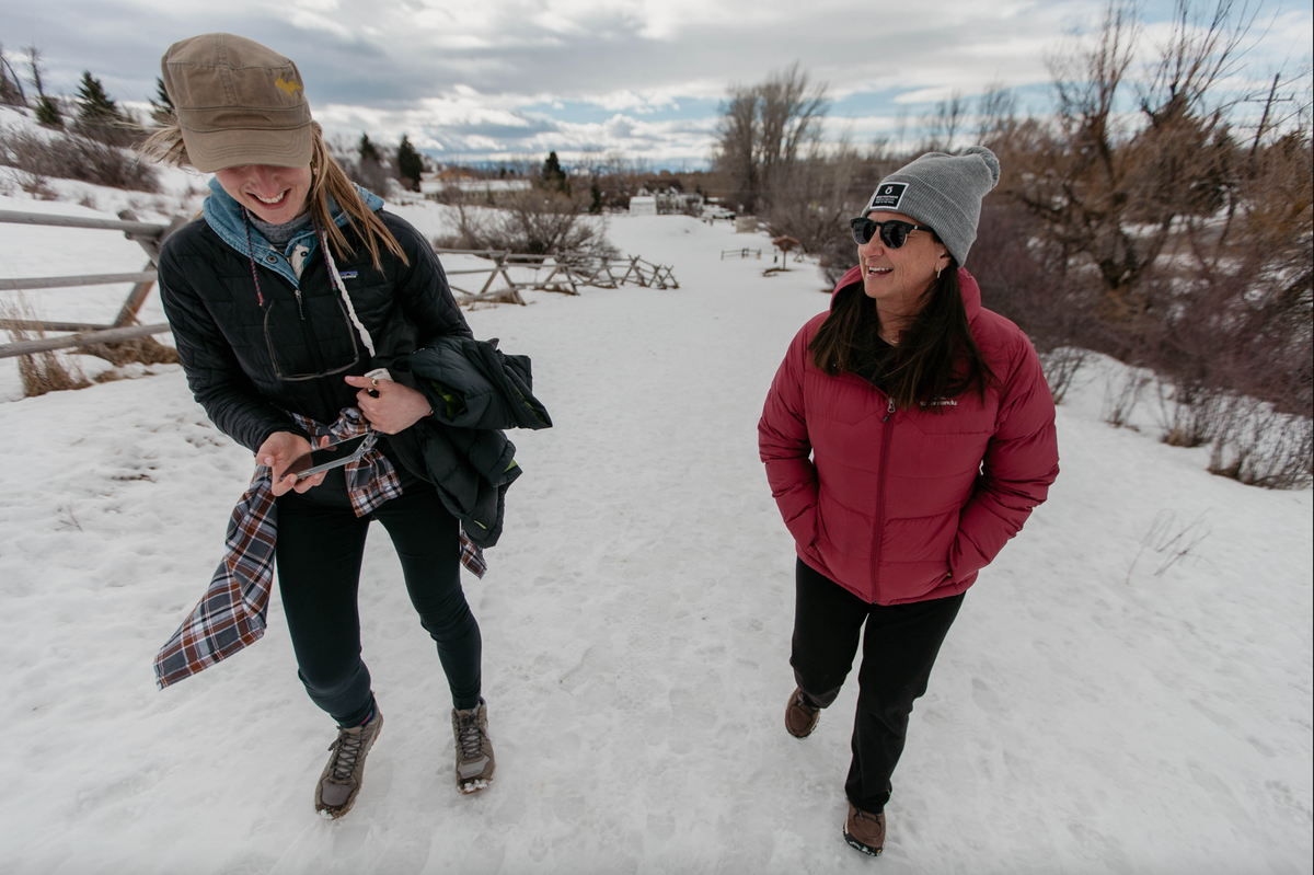 Amy Beck and a friend hiking on the snowy trails of Peet's Hill in Bozeman, Montana while wearing winter Oboz boots.