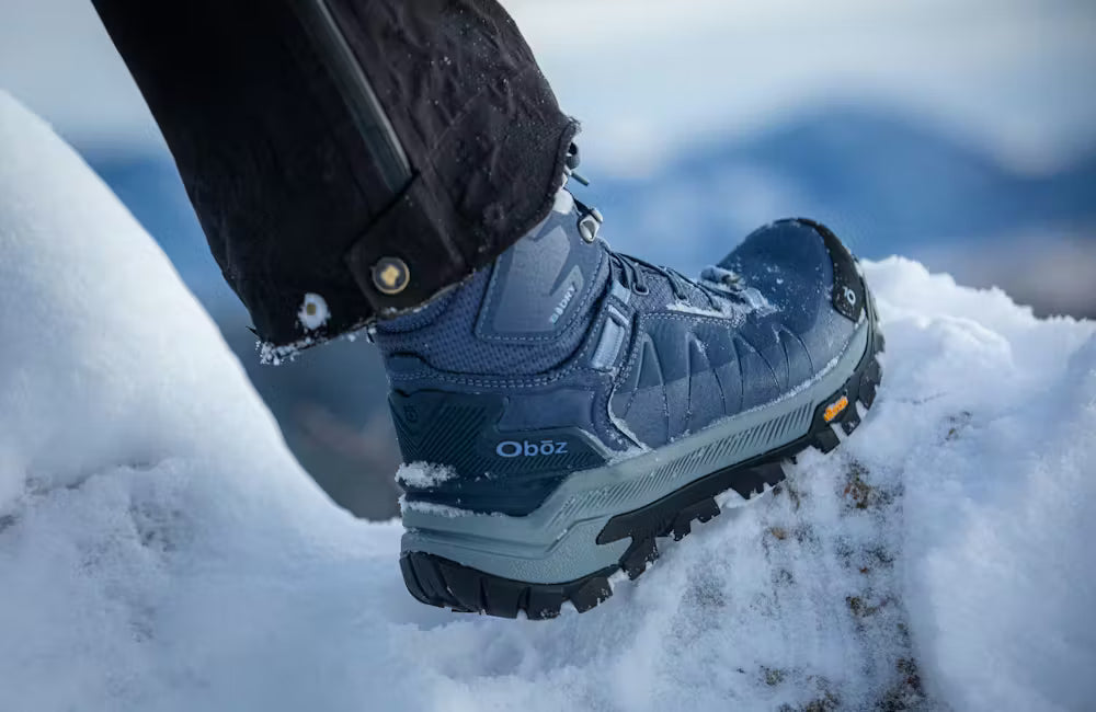 Close up view of the Oboz Bangtail winter boots in the snow.