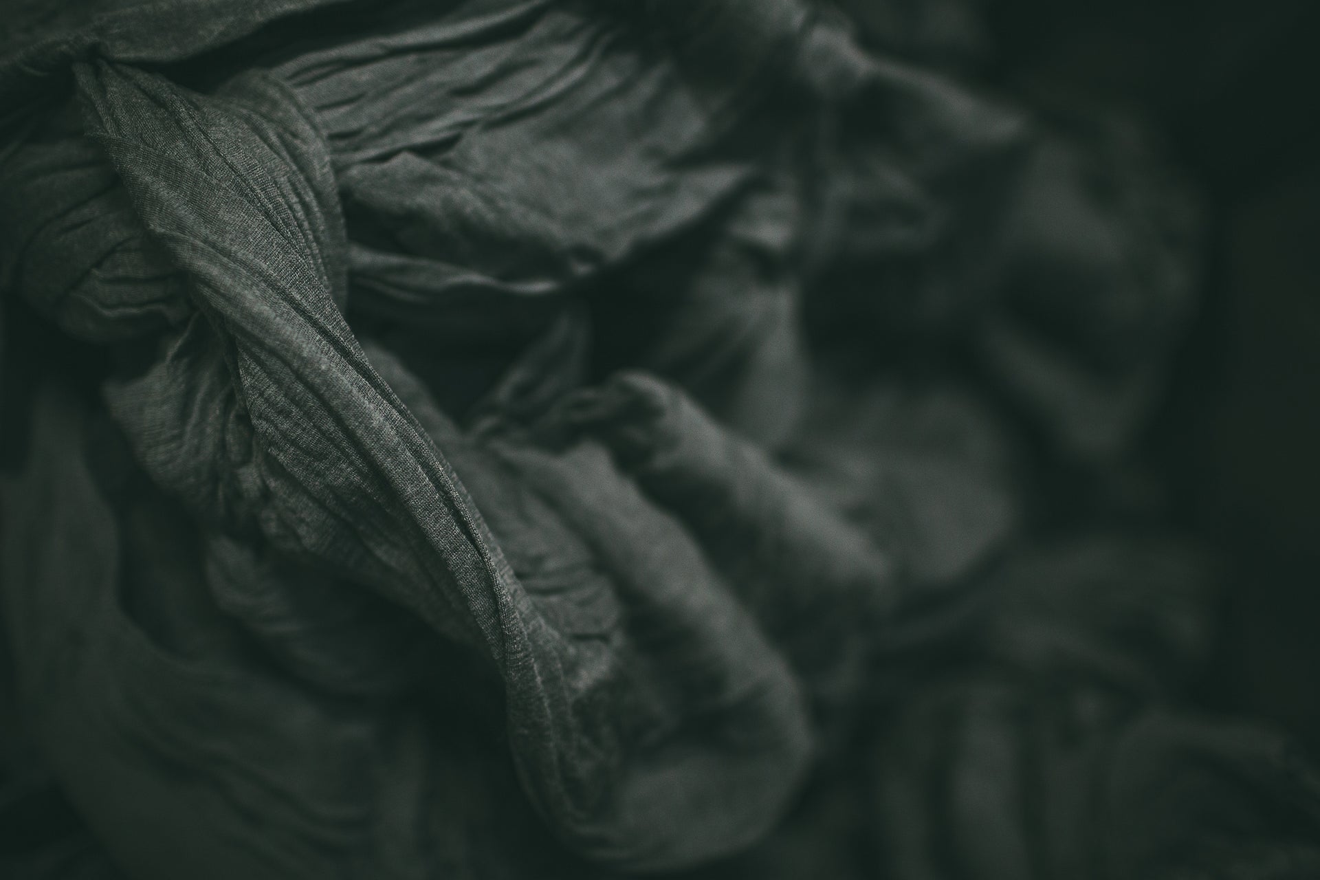 Close-up of dark green fabric texture
