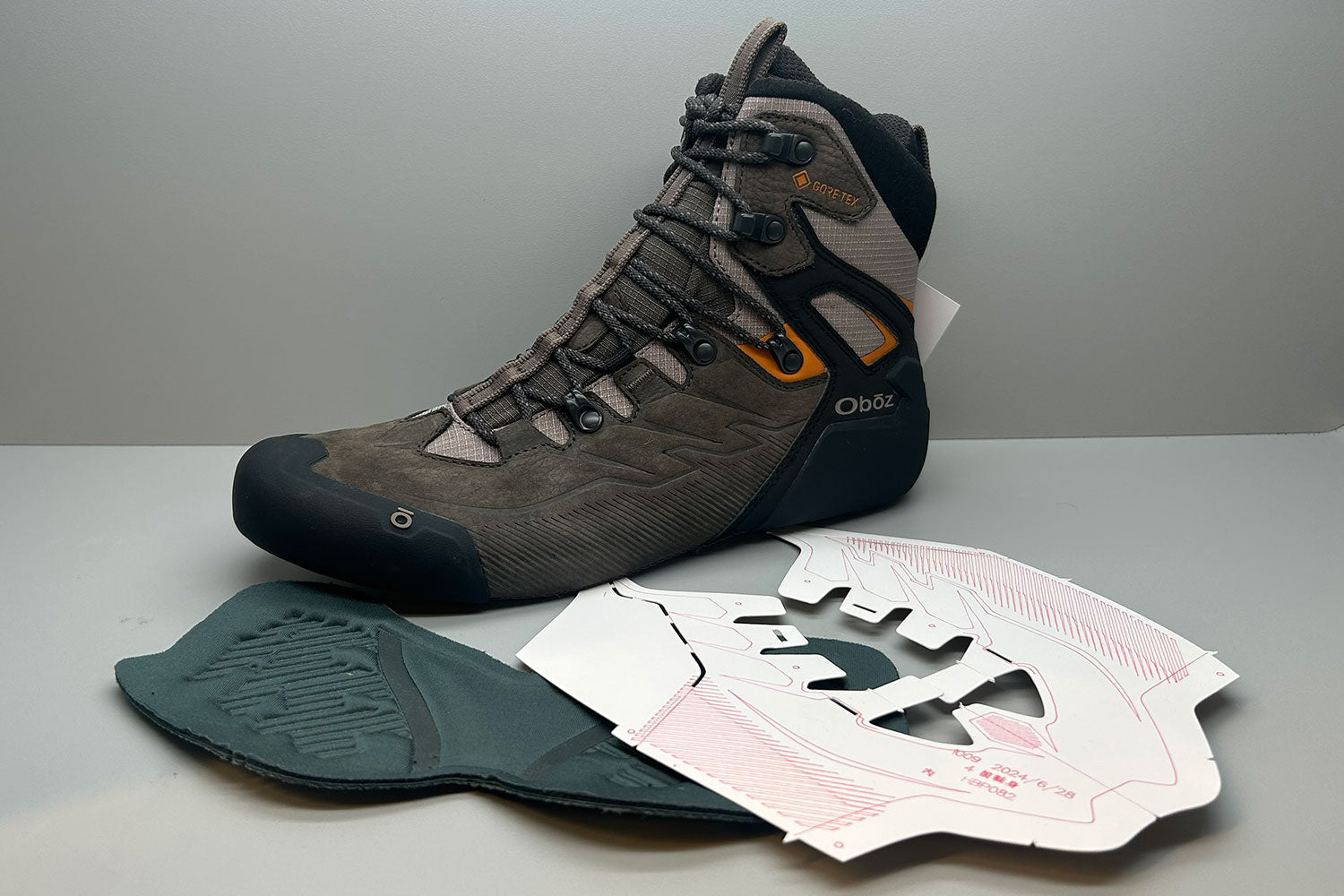 Upper of a brown Oboz Bridger Ridge boot showing how a boot is constructed.